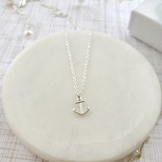 "Beautiful handmade anchor necklace in 925 sterling silver. This delicate necklace is perfect as a gift for a special woman, Christmas gift, beach wedding, bridesmaid, birthday or her special day. ♥ Details: Metal type: Sterling silver Karat / purity: 925 Anchor dimensions: 9.7 x 8.1mm Chain length: 14\", 16\", 18\", 20\". The necklace is 100% handmade. Each necklace takes approximately 2 hours to be ready, so you are buying a piece that was made with love and dedication. All jewelry comes with Nautical Style Adjustable Jewelry Gift, Adjustable Nautical Style Jewelry For Gifts, White Nautical Jewelry For Gift, Everyday Silver Anchor Jewelry, Nickel-free Sterling Silver Anchor Jewelry, Nickel-free Anchor Shaped Sterling Silver Jewelry, Everyday Silver Jewelry With Anchor Shape, Tiny White Sterling Silver Necklace, Silver Anchor Jewelry Gift