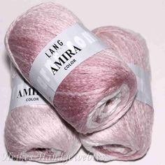 three skeins of pink yarn sitting on top of each other