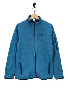 Pre owned, hard to see spot as shown in pick, very nice condition. Underarm 20" Length 27" Blue Cotton Fleece Jacket With Pockets, Blue Fleece-lined Hoodie For Winter, Blue Long Sleeve Functional Fleece Jacket, Casual Blue Fleece-lined Sweatshirt, Better Sweater, Patagonia Better Sweater, Fleece Jacket Womens, Blue Fleece-lined Sweatshirt For Outdoor, Cool Sweaters