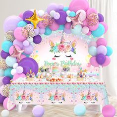 a birthday party with balloons, cake and decorations