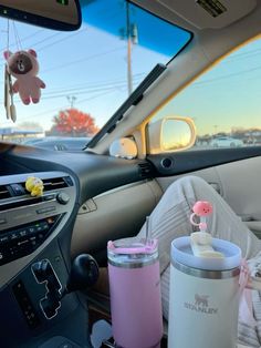 the interior of a car with baby items in it