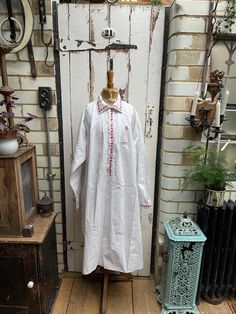 Antique French white cotton shirt nightshirt chemise with red trim size XL. 100% Cotton. Collar, button tab and cuffs with red trim detail, handgathering at back, side slits, monogram initials JB?. Size:  Chest: 54 inches; Shoulder to shoulder: 17 inches; Sleeve length: 24 inches; armhole width: 10 inches; Length: 50 inches (back). Weight: allow up to 1 kg once packed. Good condition for its age - one small black smudge at side but otherwise fine. Priced accordingly. White Cotton Shirt, Women's Nightgowns, Nightgowns, Night Shirt, Trim Detail, Monogram Initials, Wedding Shop, French Antiques, Night Gown