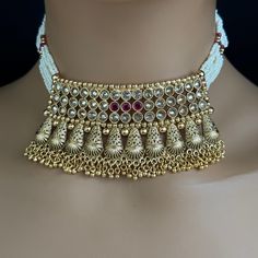 Ruby gold Polki Kundan choker Antique necklace wedding jewelry Indian Jewelry Pakistani Jewelry Wedding necklace Bridal necklace Regular Size And Adjustable Pearl Necklace Antique Necklace Set Dispatch in 1 business day Ships from California USA This is 100% Handmade jewelry. So the color, shades, and texture displayed may vary slightly from the actual product due to digital image limitations. We request you to consider these minor variations. Please expect the possibility of some slight imperfe Gold Plated Choker For Wedding, Traditional Gold Jewelry For Reception, Gold Beaded Jewelry For Reception, Festive Bridal Choker With Intricate Design, Kundan Choker Necklace With Intricate Design For Celebration, Intricate Design Kundan Choker Necklace For Celebration, Kundan Tilla Choker Necklace For Reception, Gold Jewelry Set With Intricate Design For Reception, Bridal Choker Necklace With Intricate Design For Festive Occasions