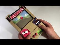 someone is holding up an old school video game case that looks like it has angry birds on it