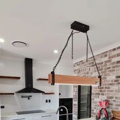 a kitchen with an oven, sink and stove top in the middle of the room