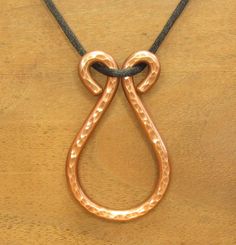 This is a stout pendant, but not overly heavy.  The pendant is 2.2" (56 mm) tall and 1.4" (36 mm) wide.  It is about 20 grams. The cord is 2 mm thick silky nylon, very smooth and very strong.  The clasp, jump rings and cord ends are all stainless steel and heavy duty. Copper begins to tarnish, after polishing, as soon as it's exposed to the oxygen in air.  The rate of tarnish changes when it touches the oils in human skin.  The effect varies from person to person.   On some people, copper tarnishes very little or none.  On others, copper tarnishes very quickly.  Everyone has a unique body chemistry in how it affects the patina of copper jewelry. Most of the time, copper patina is brick red, dark brown, black or green, but blue and pink are also possible. Tarnish usually lessens with time. Silversmithing Jewelry, Iron Jewelry, Copper Art, Wire Work Jewelry, Work Jewelry, Pure Copper, Copper Pendants, Creative Jewelry, Leather Projects