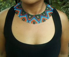 Embera necklace made by a woman from the Embera tribe in colombia Unique Boho Collar Jewelry As Gift, Unique Boho Collar Necklace As Gift, Unique Boho Collar Necklace For Gift, Unique Boho Collar Jewelry, Handwoven Turquoise Jewelry For Festival, Fair Trade Unique Beaded Necklaces, Artisan Boho Collar Necklace As A Gift, Artisan Boho Collar Necklace For Gift, Artisan Festival Choker Necklace