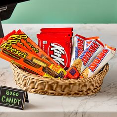 a wicker basket filled with candy and snacks