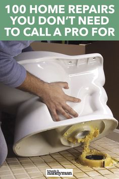 a man is using a toilet bowl to flush it with the lid open and his hands are