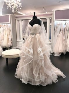 a wedding dress on display in a bridal shop