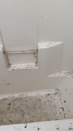 the inside of a bathroom that is dirty and needs to be cleaned or remolded