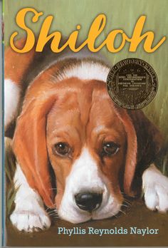 a book cover with a dog laying on the ground and it's name shiloh