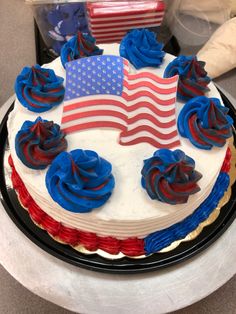 an american flag cake with red, white and blue frosting