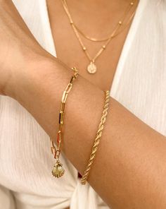 This Anna rope bracelet is the ultimate gold jewelry piece for you! With simple and yet a minimal design. Non tarnish and crafted with gold filled materials, this essential piece can easily be worn for any occasion - whether it's for a night out or just an everyday casual look. This delicate and dainty piece can be worn alone or even stacked with other bracelets, making it an essential addition to your jewelry collection. • Single Bracelet• Gold Filled• Length: 6.5" (option to add +1" extender)• Minimalist Metal Braided Bracelets For Everyday, Minimalist Gold-plated Bracelet With Lobster Clasp, Minimalist Metal Jewelry With Rope Chain, Everyday Minimalist Metal Braided Bracelets, Minimalist Metal Rope Chain Jewelry, Adjustable Gold Rope Chain Bracelet, Everyday Gold Rope Chain Bracelet, Minimalist Gold-plated Bracelets With Lobster Clasp, Minimalist Gold Plated Bracelet With Lobster Clasp