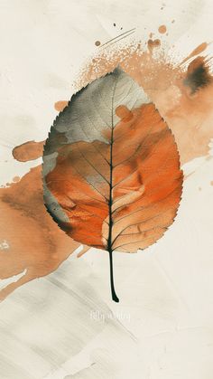 an orange and gray leaf on a white background with watercolor splashes around it