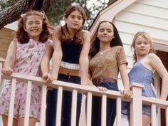 three girls standing on a porch with the caption which now and then character are you?