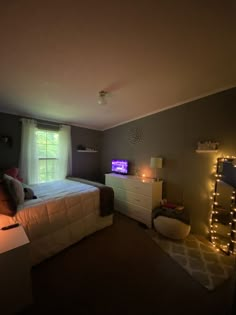 a bed room with a neatly made bed next to a window