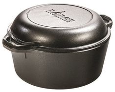 a black pot with a lid sitting on a white surface