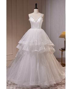 Get 10% off now! Buy elegant ruffled ballgown long white wedding dress with beaded pearls at cheap price online. Free stable shipping and pro custom service since 2009. Long White Wedding Dress, Tulle Long Prom Dress, Pearl Wedding Dress, Dress With Train, A Line Evening Dress, White Wedding Dress, Dress A Line, White Tulle, فستان سهرة