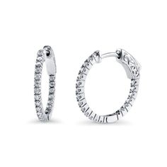 These inside-out hoop earrings sparkle in a simple effortless style from every angle. Crafted with sterling silver, rhodium plated, stamped 925, nickel free. Set with premium quality 0.42 carat total (1.25mm) round cubic zirconia in pave setting. Earrings measure 0.1" in width, 0.8" in diameter. Hinged snap backs. Jewelry Education, Medium Fashion, Hoop Earring Sets, Sparkle Earrings, Earrings Hoop, Pave Setting, Accessories Jewelry Earrings, Snap Backs, Jewelry Earrings Hoops