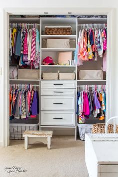 an organized closet with clothes and baskets