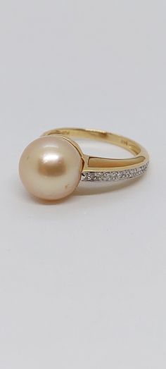 GOLDEN South Sea Pearl Ring 14k. Diamond Pearl Engagement Ring, Vintage Pearl Engagement Ring,14K Yellow Gold Golden South Sea Pearl. 10-11mm Pearl Ring with yellow Mother of Pearl and Diamonds. Product Info: - Stone: Golden South Sea, Yellow Mother of Pearl and Diamonds. - Pearl Color: Golden. - Pearls size: 10-11mm round. - Sparkling diamonds. - Metal: 14K Yellow Gold. - Ring Size 7 - Made in USA. - Nice Gift Box Included Luxury Hallmarked Yellow Gold Pearl Ring, Luxury Yellow Gold Brilliant Cut Pearl Ring, South Sea Pearl Ring, Pearl Engagement Ring, Golden South Sea Pearls, Vintage Pearl, Sea Pearl, South Sea Pearls, Sea Pearls