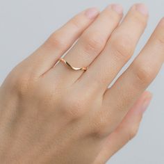 The Curved Lyon band is our fabulous alternative to the traditional Lyon band. The 18k gold band has a gentle curve allowing an engagement ring, such as a halo-style, to fit snuggly against it. Each Curved Lyon is made to order in your ring size so please allow approximately 4 weeks for delivery. The band can be made in 18k yellow, rose and white gold, or platinum! (Pictured in 18k Rose Gold) Wedding 14k Gold Halo Ring, Classic Curved 14k Gold Jewelry, Minimalist Curved Wedding Jewelry, Classic Curved 14k Gold Rings, Elegant 14k Gold Curved Rings, Minimalist Curved Wedding Rings, Curved 14k Gold Jewelry For Anniversary, Elegant Curved Rings For Anniversary, 14k Gold Curved Jewelry For Anniversary