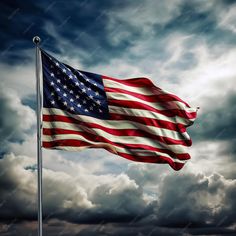 an american flag blowing in the wind on a cloudy day with dark clouds behind it