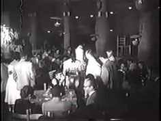 an old black and white photo of people at a party