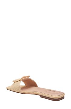 Named for the ever-charming kiwi bird, this slide sandal charms as well with its scallop-edged strap cinched with an oversized statement buckle. Flat sole Leather upper and lining/rubber and synthetic sole Imported Latinx Owned/Founded Casual Slides With Textured Sole, Chic Slides With Woven Sole, Chic Open Toe Slides With Textured Sole, Chic Slip-on Slides With Textured Footbed, Elegant Flat Slides With Textured Footbed, Chic Slides With Buckle Closure And Flat Heel, Chic Flat Slides With Cushioned Footbed, Chic Cushioned Flat Slides, Chic Flat Slides With Textured Footbed