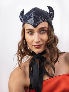 The headpiece features black sequin fabric and playful horns, making it a perfect addition to any costume.  One size fits most, head circumference- 22-23 inches.  Lightweight and comfortable to wear all night long. The bonnet is completely lines and has long ties, which you can tie into a bow, leave hanging like a scarf, or style however you like. Fits a variety of Halloween and Cosplay costumes. Pair it with your evening outfit and turn it into a Halloween or party costume with just one headpie Witchy Winter Party Costume Hats And Headpieces, Adjustable Ears Costume Accessories For Party, Adjustable Ears Costume Accessories For Costume Party, Adjustable Costume Accessories With Ears For Costume Party, Fitted Novelty Costume Accessories With Cat Ears, Adjustable Black Costume Accessories For Winter, Novelty Black Costume Accessories For Winter, Black Novelty Costume Accessories For Winter, Black Adjustable Costume Accessories