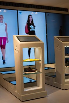 two display cases with shoes in front of them