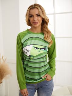 Green Grinch Stole Print Round Neck Long Sleeve Sweatshirt Green Long Sleeve Sweater With Letter Print, Green Cartoon Print Top For Fall, Green Cartoon Print Tops For Fall, Green Long Sleeve Cartoon Print Top, Green Long Sleeve Top With Cartoon Print, Green Long Sleeve T-shirt For Fall, Winter Cartoon Print Relaxed Fit Tops, Green Long Sleeve Sweatshirt With Graphic Print, Green Long Sleeve Sweater With Graphic Print