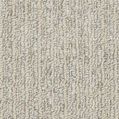 an up close shot of a beige carpet