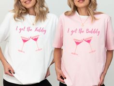 two women wearing matching t - shirts that say i got the bubbly and i get the bubbly