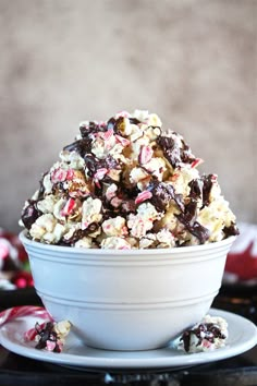 a white bowl filled with chocolate and candy canes