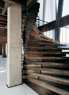 a wooden stair case in an office building