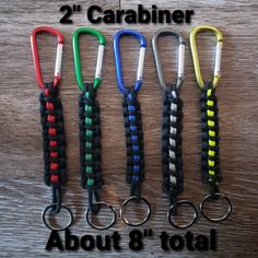 four carabiner hooks are lined up on a table with the words about 8'total