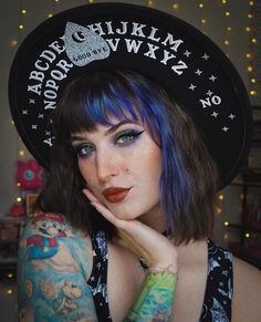 "Welcome to Witchwood's brand new XL wide brim hats! These hats have our biggest brim yet! They are made of sturdy vegan felt and are all hand printed.   Vegan Felt Size: 23\" (but size is adjustable and can be sized down, inside the hat) PLEASE NOTE: These hats have a bit more \"give\" to the circumference and can fit a slightly bigger size than our other wide brim hats Brim - 3.75\" wide Hat Color - Black Print Color - White and Silver Glitter     Model is @battybean_" Wide Hat, Halo Glow, New Eyeshadow Palettes, Goth Witch, 2 Broke Girls, Spirit Board, Wide Brim Hats, Hat Beret, Brim Hats