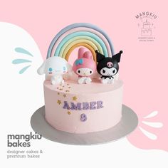 there is a pink cake decorated with animals and rainbows on the top it says amakiu bakes