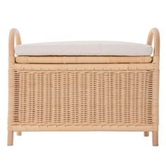 a wicker bench with a cushion on it