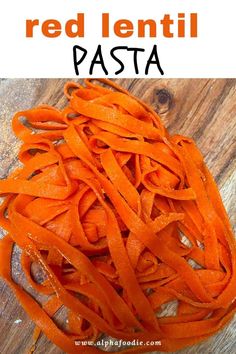 red lentil pasta on a wooden table with text overlay