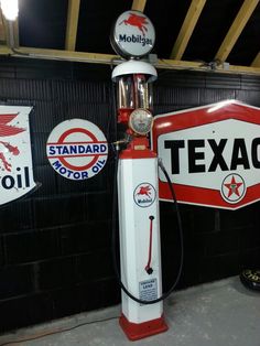 an old texaco gas pump in a garage