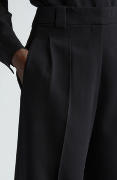 These pleated high-waist pants are immaculately tailored in a cuffed barrel-leg silhouette from signature Finesse crepe that's tactile with impeccable drape. Precision darting in back lends a flawless fit. 27" inseam; 19" leg opening; 12 1/2" front rise; 18" back rise (size 8) Zip fly with hook-and-bar closure Side-seam pockets; back welt pockets 71% acetate, 29% polyester Dry clean Imported Designer Clothing Classic Wide-leg Pants With Pleated Waist, Elegant Wide Leg Dress Pants With Concealed Placket, Luxury Wide Leg Pants With Pressed Crease, Elegant Tailored Wide Leg Pants With Straight Hem, Luxury Wide Leg Pants With Pressed Crease For Evening, Elegant High-waisted Wide Leg Pants With Concealed Placket, Luxury Wide-leg Dress Pants With Pressed Crease, Formal Wide-leg Pants With Structured Boning, Luxury Formal Wide Leg Pants With Pressed Crease