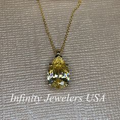 "The pendant pictured is canary yellow simulated diamond #7060 -Approximate total carat weight: approx. 3.60ctw diamond equivalent -Center Stone Size: 12x8mm - approx. 3.60ct diamond equivalent -Center Stone Shape: pear / tear drop -Gem Type: simulated diamond -Stone Clarity: VVS1 -Stone Color: Canary Yellow -Moh's Scale: 8.5 hardness -Metal Type and Purity: 14k yellow gold -Setting: 5 prong basket head -Size: Height with bail approx 15.30mm x Width approx. 8mm -Chain: delicate 14k gold chain / Gia Certified Fine Yellow Jewelry, Gia Certified Yellow Fine Jewelry, Yellow Diamond-cut Necklace In Fine Jewelry Style, Yellow Diamond Cut Necklace In Fine Jewelry Style, Classic Yellow Diamond Cut Necklace, Classic Yellow Diamond Necklace, Classic Yellow Gia Certified Jewelry, Gia Certified Yellow Gold Teardrop Jewelry, Pear-shaped Yellow Jewelry With Diamond Accents