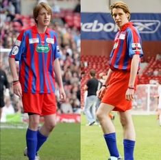 two soccer players in red and blue uniforms