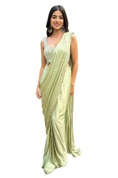 Pista green pre-draped satin georgette saree with sequin-bead fleur border and floret buti embellishments. Paired with a flora embroidered blouse. - Aza Fashions Green Silk Saree For Evening, Green Pre-draped Saree For Wedding, Green Draped Saree For Wedding, Green Silk Pre-draped Saree For Evening, Evening Green Silk Saree, Elegant Pista Green Art Silk Dress, Green Pre-draped Saree For Reception, Elegant Green Art Silk Dress, Green Silk Pre-draped Saree In Traditional Style