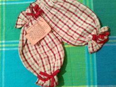 two red and white checkered cloths with a note attached to the top one