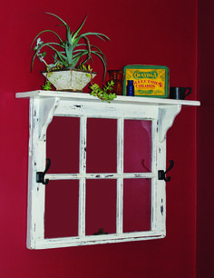 a potted plant sitting on top of a window sill next to a red wall