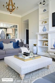 a living room filled with furniture and a fire place